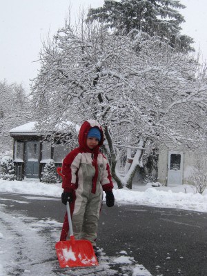 boy with snow shovel