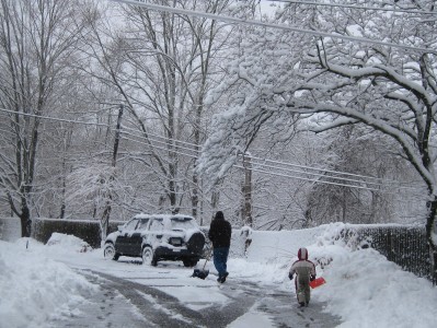 son and dad shoveling snow