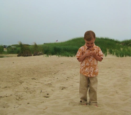 little boy on beach during wedding