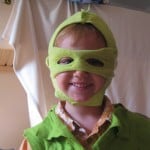 boy in selfmade dragon costume
