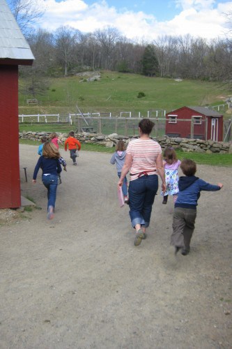 kids of 4-H group running on farm