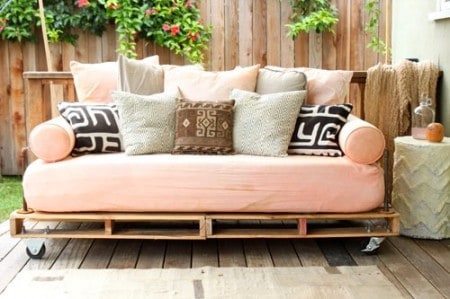 day bed made out of pallets on deck